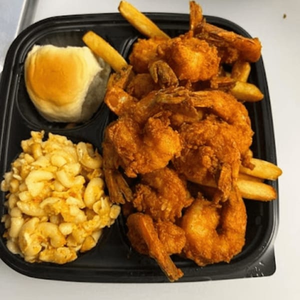 C & E Southern Bites' fried shrimp, french fries, mac and cheese, and a dinner roll.