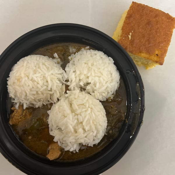 C & E Southern Bites' gumbo with three scoops of rice and a side of cornbread.